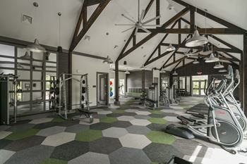 Fully-equipped fitness center with vaulted ceilings
